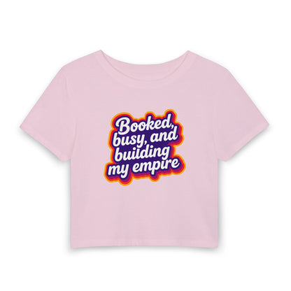 Booked, busy, and building my empire Crop Tee