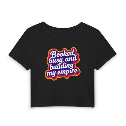 Booked, busy, and building my empire Crop Tee